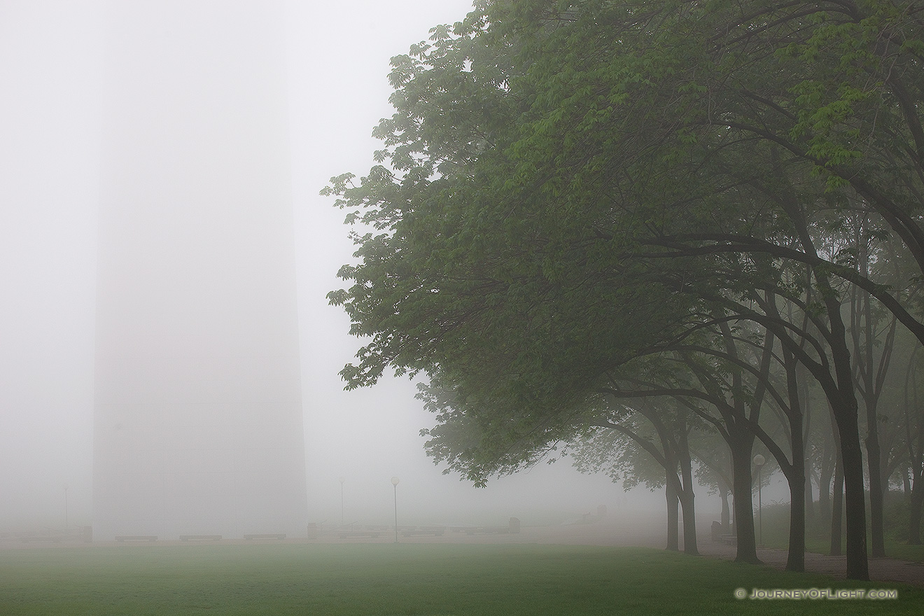 Through the thick fog the Gateway Arch in St. Louis is barely visible. - Jefferson National Expansion Memorial Picture